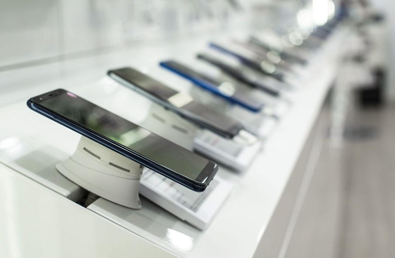 Smartphones on shelf in the store. Concept for communications an